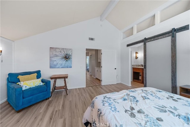 1440 Amanda Pl, Upland, CA 91784 - bedroom featuring a barn door, beamed ceiling, high vaulted ceiling, wood finished floors, and connected bathroom