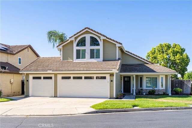 1440 Amanda Pl, Upland, CA 91784 - traditional-style house with concrete driveway and a tile roof