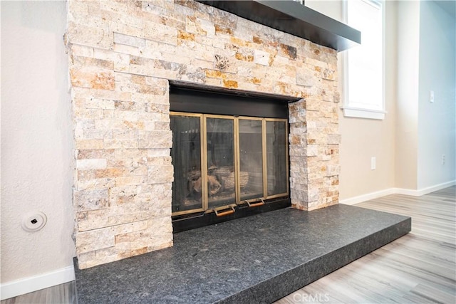 1440 Amanda Pl, Upland, CA 91784 - detailed view of a stone fireplace and wood finished floors