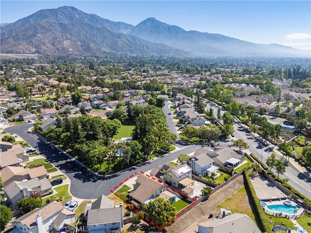 1440 Amanda Pl, Upland, CA 91784 - aerial perspective of suburban area featuring property boundaries highlighted and a mountain backdrop
