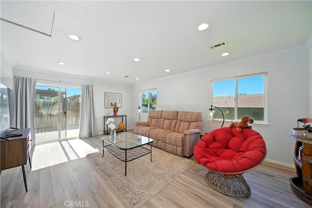 1440 Amanda Pl, Upland, CA 91784 - living room featuring ornamental molding, plenty of natural light, wood finished floors, and recessed lighting