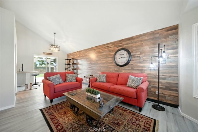 1440 Amanda Pl, Upland, CA 91784 - living area with an accent wall, wood finished floors, high vaulted ceiling, and wooden walls