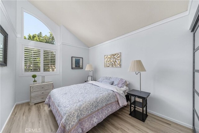 1440 Amanda Pl, Upland, CA 91784 - bedroom with wood finished floors and high vaulted ceiling