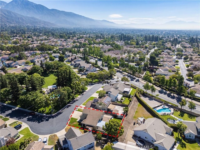 1440 Amanda Pl, Upland, CA 91784 - aerial view of residential area with property boundaries highlighted and a mountain backdrop