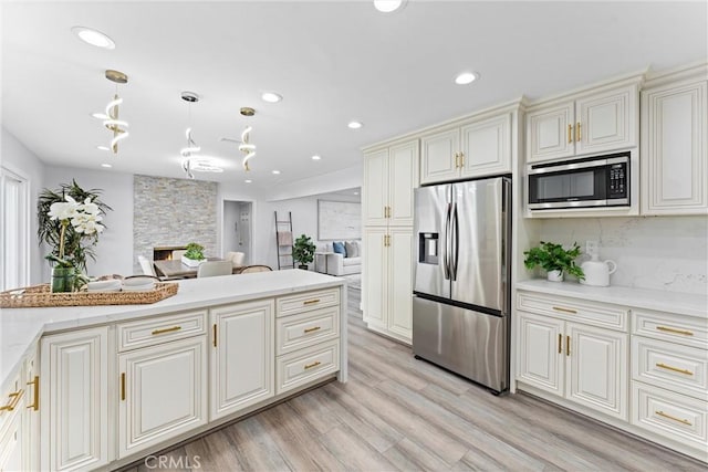 4802 Brookway Ave, Yorba Linda, CA 92886 - kitchen with appliances with stainless steel finishes, light wood-style floors, pendant lighting, recessed lighting, and open floor plan