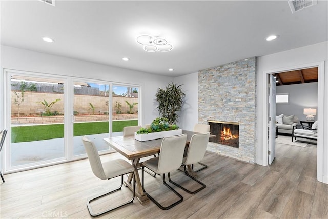 4802 Brookway Ave, Yorba Linda, CA 92886 - dining room with a stone fireplace, light wood-type flooring, and recessed lighting