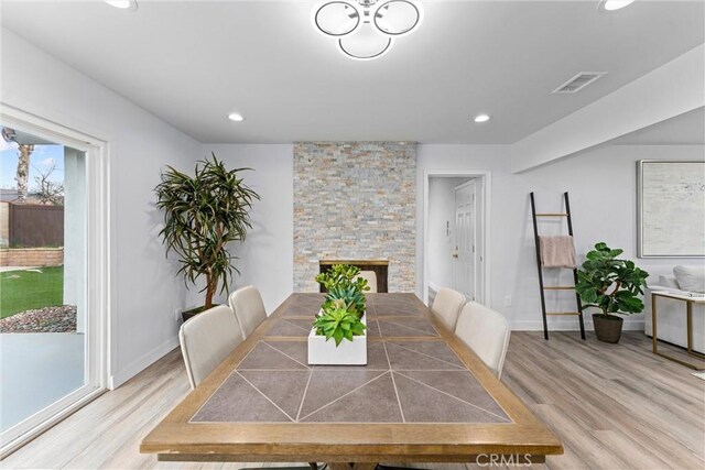 4802 Brookway Ave, Yorba Linda, CA 92886 - dining area with light wood finished floors, recessed lighting, and a stone fireplace