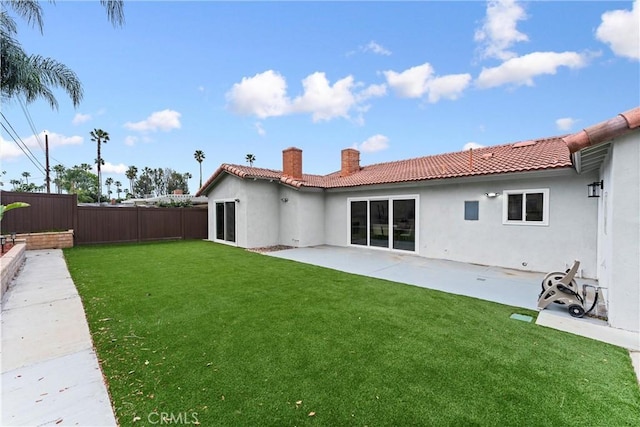 4802 Brookway Ave, Yorba Linda, CA 92886 - back of house featuring a chimney, a fenced backyard, a patio, a tiled roof, and stucco siding