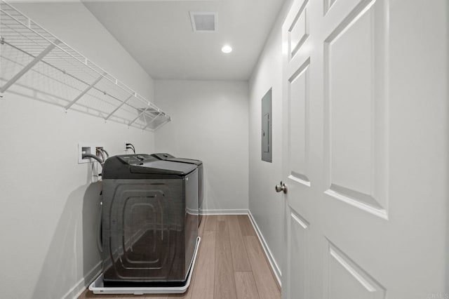 28339 Levi Way, Menifee, CA 92585 - washroom with washer and clothes dryer, light wood-style floors, recessed lighting, and electric panel
