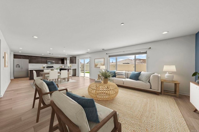 28339 Levi Way, Menifee, CA 92585 - living area with light wood-type flooring and recessed lighting