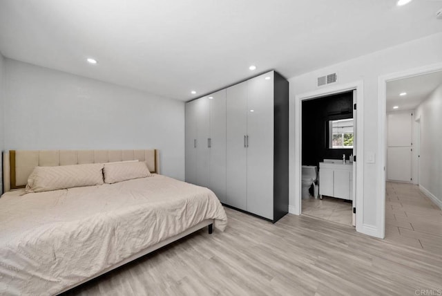 7971 Jade Coast Rd, San Diego, CA 92126 - bedroom featuring light wood finished floors, recessed lighting, a closet, and connected bathroom