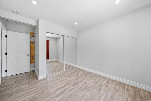 7971 Jade Coast Rd, San Diego, CA 92126 - unfurnished bedroom with a closet, light wood-style flooring, and recessed lighting