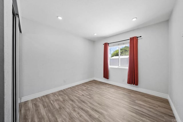7971 Jade Coast Rd, San Diego, CA 92126 - spare room featuring wood finished floors and recessed lighting