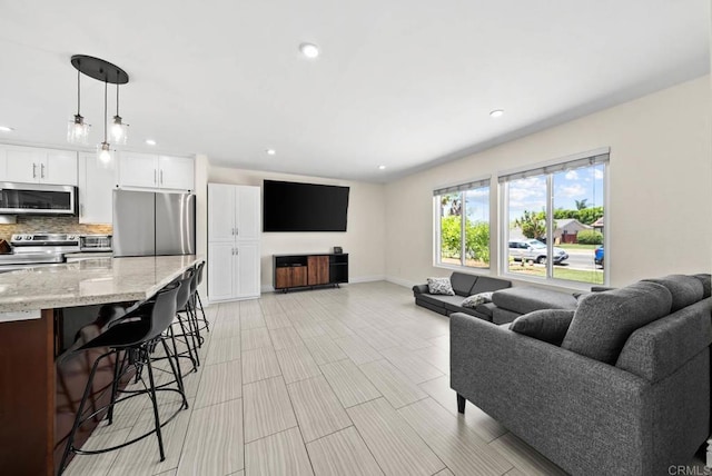 7971 Jade Coast Rd, San Diego, CA 92126 - living area featuring recessed lighting and baseboards