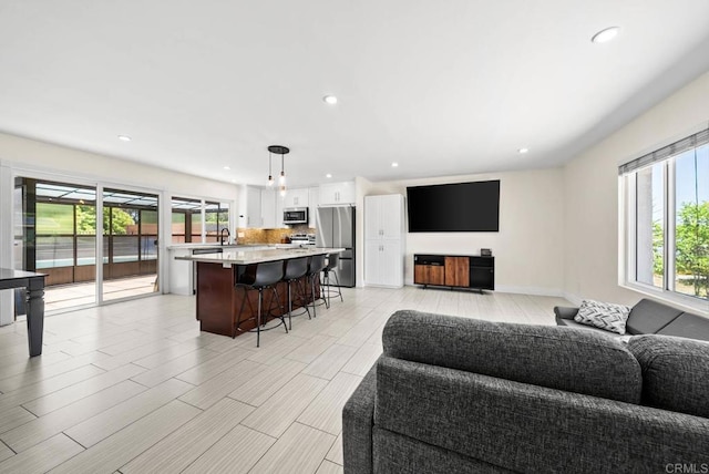7971 Jade Coast Rd, San Diego, CA 92126 - living room with recessed lighting and light wood-style floors