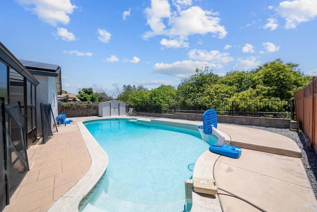 7971 Jade Coast Rd, San Diego, CA 92126 - view of pool featuring a fenced backyard, a patio, and a storage unit