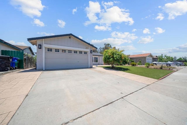 7971 Jade Coast Rd, San Diego, CA 92126 - ranch-style house featuring driveway, a front lawn, an attached garage, and board and batten siding