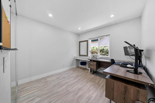 7971 Jade Coast Rd, San Diego, CA 92126 - home office with light wood-style flooring and recessed lighting