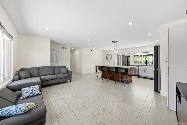 7971 Jade Coast Rd, San Diego, CA 92126 - living room with recessed lighting and baseboards
