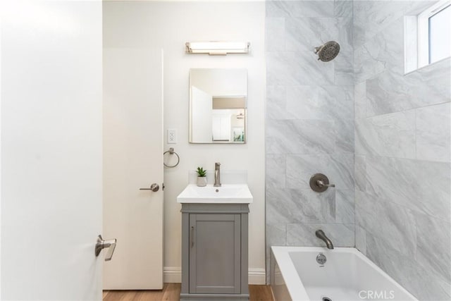 2283 Gaviota Ave, Signal Hill, CA 90755 - bathroom featuring vanity, bathtub / shower combination, and wood finished floors