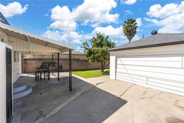 2283 Gaviota Ave, Signal Hill, CA 90755 - view of patio with a garage and outdoor dining space