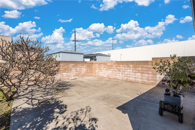 2283 Gaviota Ave, Signal Hill, CA 90755 - fenced backyard featuring a patio area