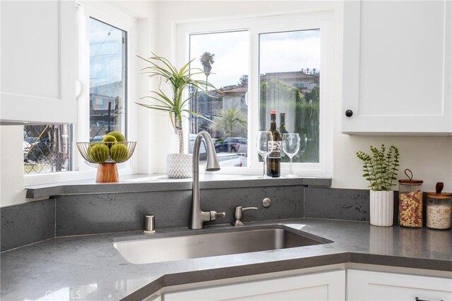 2283 Gaviota Ave, Signal Hill, CA 90755 - kitchen with white cabinetry and dark countertops