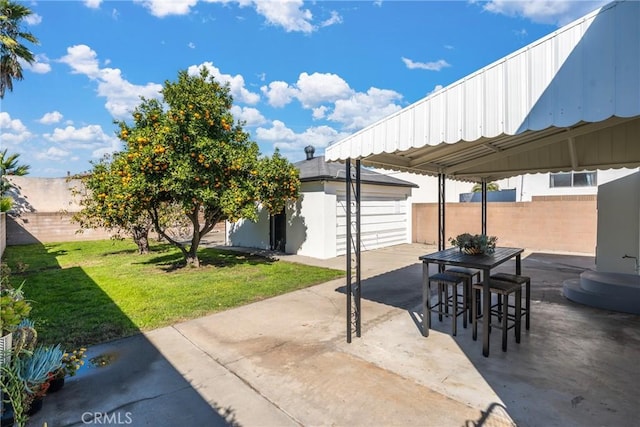 2283 Gaviota Ave, Signal Hill, CA 90755 - fenced backyard with a patio, an outbuilding, and a detached garage