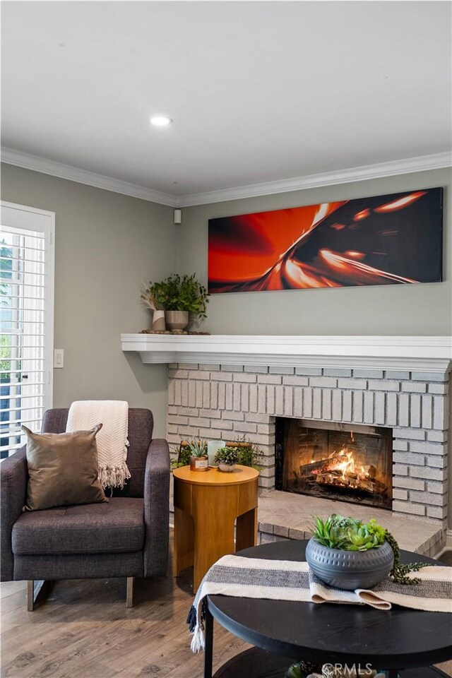 11243 Gaviota Ave, Granada Hills, CA 91344 - living area featuring a fireplace, wood finished floors, ornamental molding, and recessed lighting