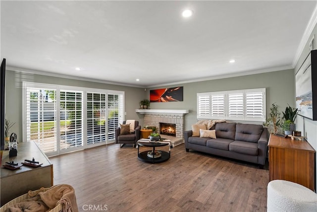 11243 Gaviota Ave, Granada Hills, CA 91344 - living room featuring a fireplace, wood finished floors, crown molding, and recessed lighting