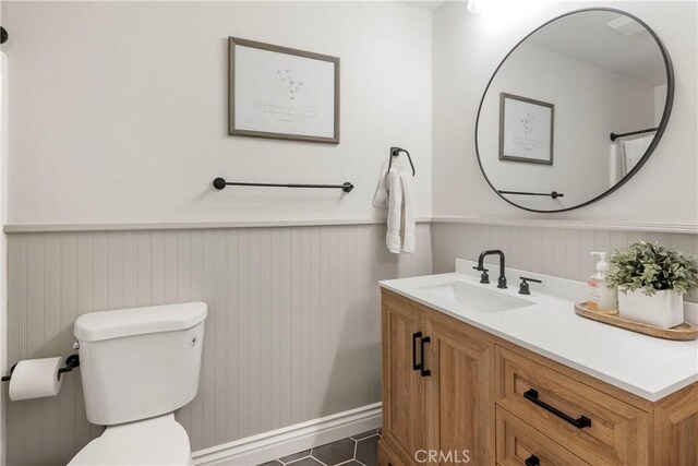 2151 Stonefield Pl, Riverside, CA 92506 - bathroom with a wainscoted wall, vanity, and tile patterned flooring
