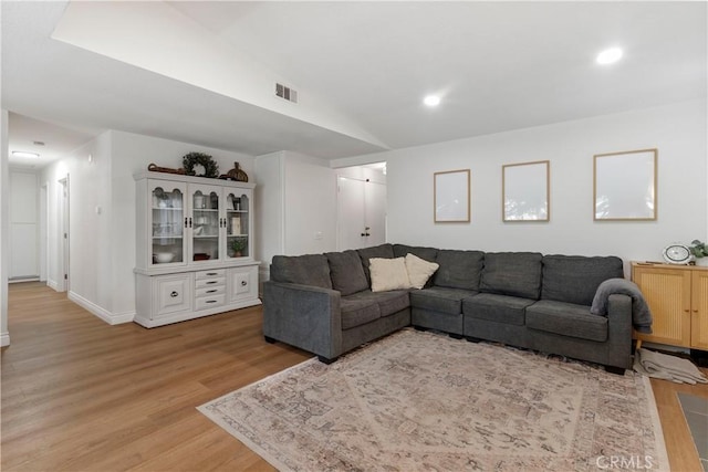 2151 Stonefield Pl, Riverside, CA 92506 - living area with light wood-type flooring, vaulted ceiling, and recessed lighting