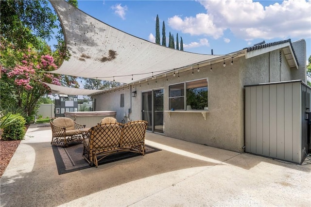 2151 Stonefield Pl, Riverside, CA 92506 - view of patio with a hot tub and an outdoor hangout area