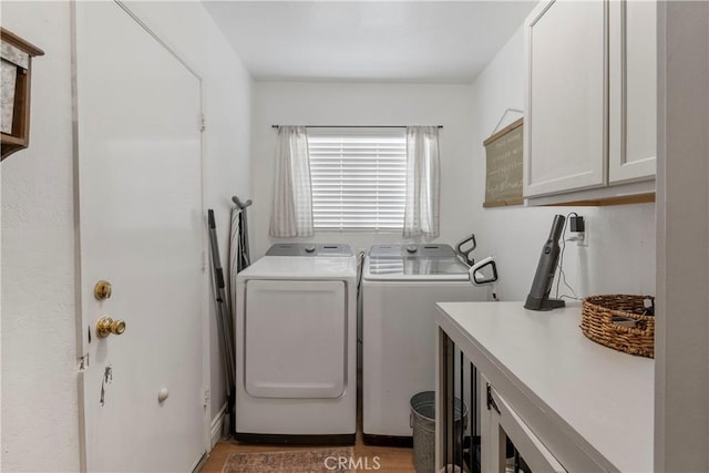 2151 Stonefield Pl, Riverside, CA 92506 - washroom with cabinet space, independent washer and dryer, and light wood-type flooring