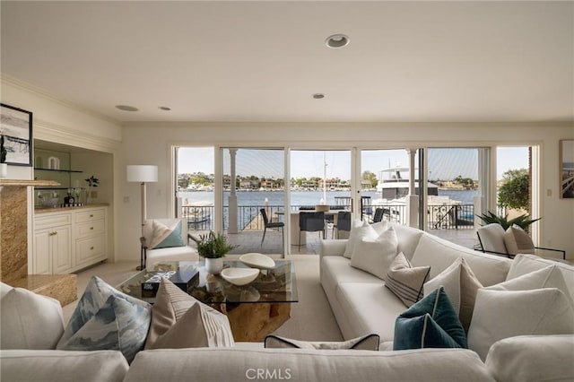 816 Via Lido Nord, Newport Beach, CA 92663 - living area with ornamental molding, a water view, plenty of natural light, and light carpet