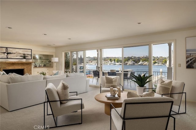 816 Via Lido Nord, Newport Beach, CA 92663 - carpeted living area with a water view, a fireplace, and crown molding