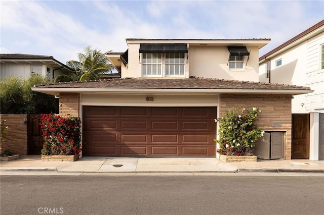 816 Via Lido Nord, Newport Beach, CA 92663 - view of front of house featuring stucco siding, an attached garage, and driveway