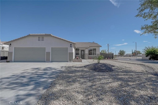 11490 Autumn St, Adelanto, CA 92301 - ranch-style house featuring stucco siding, an attached garage, driveway, and a tiled roof