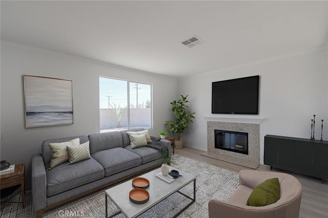 11490 Autumn St, Adelanto, CA 92301 - living area with wood finished floors, a premium fireplace, and crown molding
