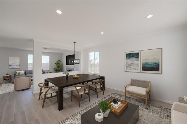 11490 Autumn St, Adelanto, CA 92301 - living room featuring light wood-style flooring, a fireplace, and recessed lighting