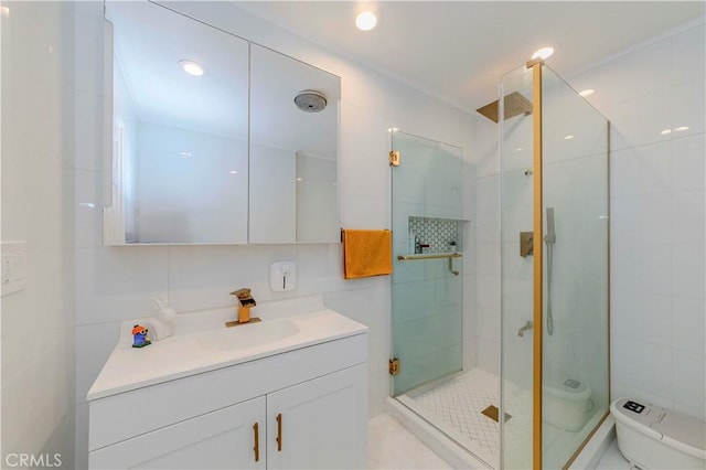 358 S Gramercy Pl Unit 201, Los Angeles, CA 90020 - bathroom with tile walls, vanity, a shower stall, and recessed lighting