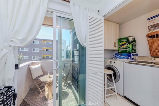 358 S Gramercy Pl Unit 201, Los Angeles, CA 90020 - washroom featuring cabinet space and independent washer and dryer