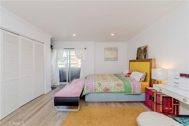 358 S Gramercy Pl Unit 201, Los Angeles, CA 90020 - bedroom with crown molding, wood finished floors, a closet, and recessed lighting