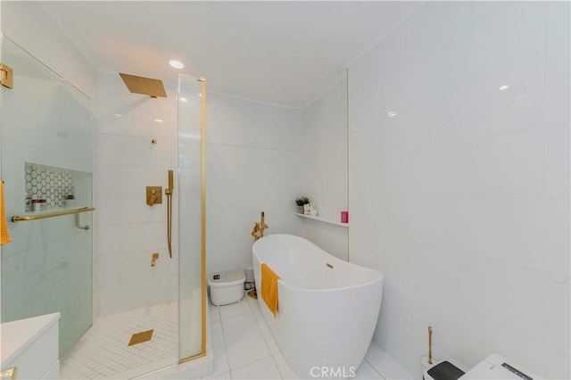 358 S Gramercy Pl Unit 201, Los Angeles, CA 90020 - bathroom featuring a stall shower, tile walls, a freestanding tub, and tile patterned flooring