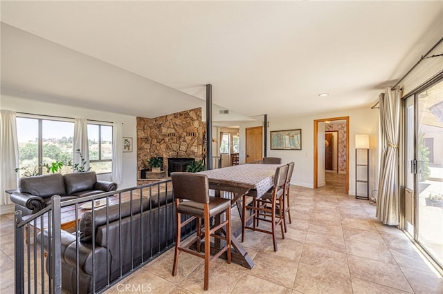 14320 Kiptree Dr, Lake Hughes, CA 93532 - dining room with healthy amount of natural light and a fireplace