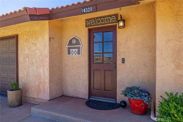 14320 Kiptree Dr, Lake Hughes, CA 93532 - doorway to property with stucco siding
