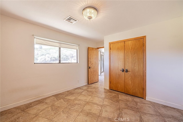 14320 Kiptree Dr, Lake Hughes, CA 93532 - unfurnished bedroom featuring a closet and baseboards
