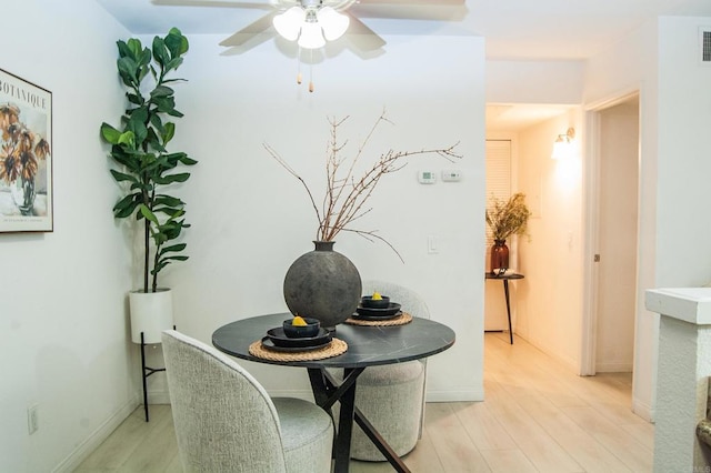 12191 Cuyamaca College Dr E Unit 703, San Diego, CA 92019 - dining room with light wood-style flooring and a ceiling fan
