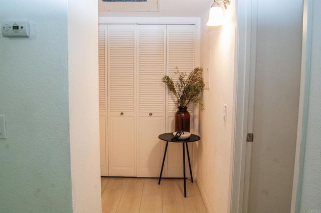 12191 Cuyamaca College Dr E Unit 703, San Diego, CA 92019 - hall featuring light wood-type flooring and a textured wall
