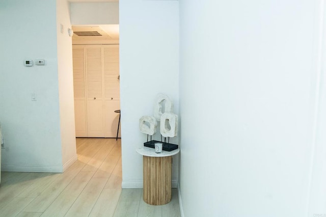 12191 Cuyamaca College Dr E Unit 703, San Diego, CA 92019 - hallway featuring wood finished floors and baseboards